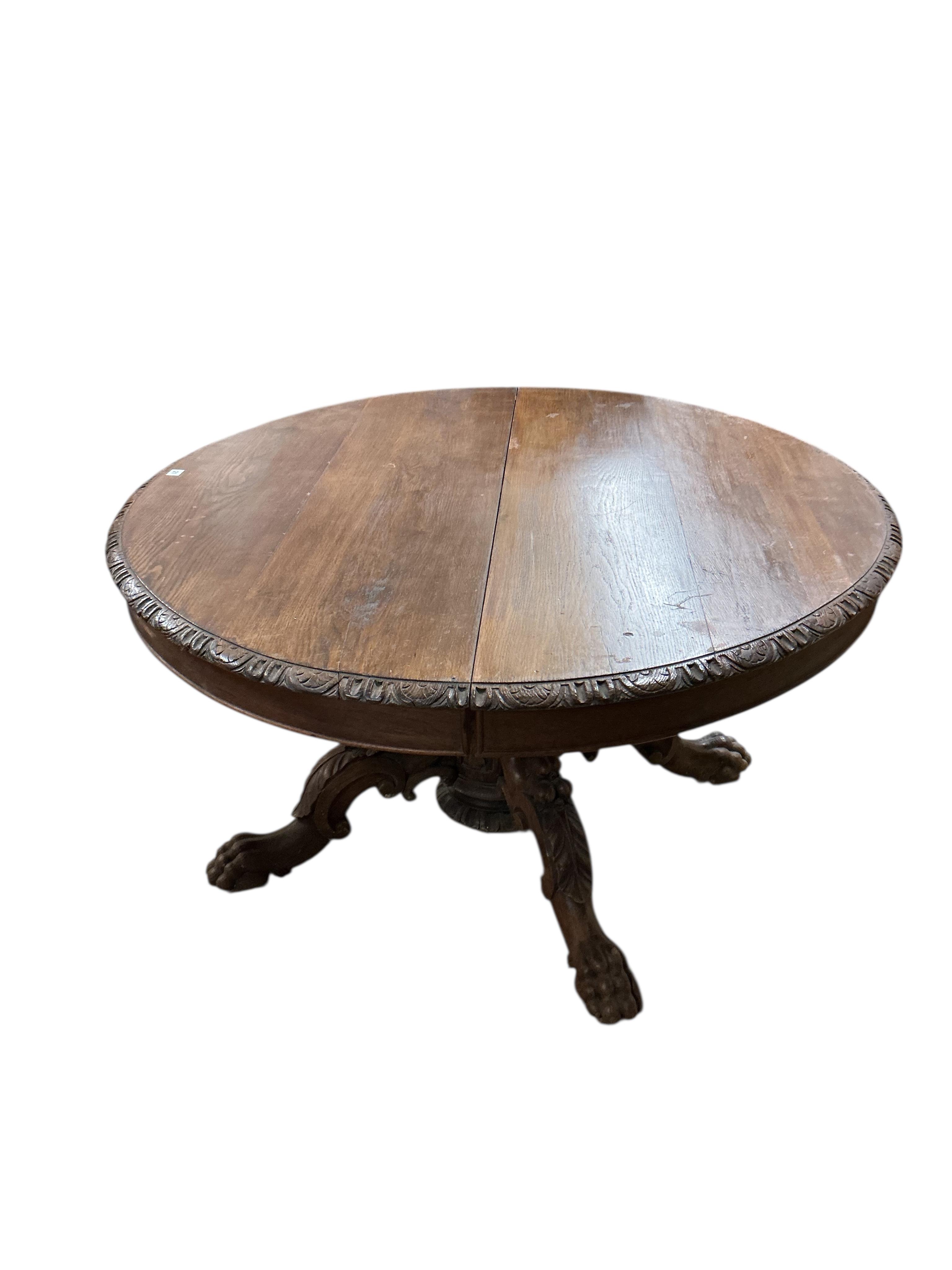 A 19th century oval oak extending dining table, (no leaves), width 142cm, depth 122cm, height 71cm